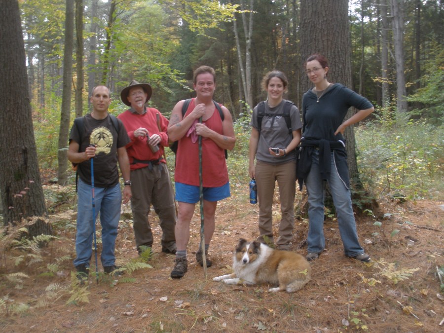 A trail reconnaissance team pauses near the Millers River by Ivan Ussach